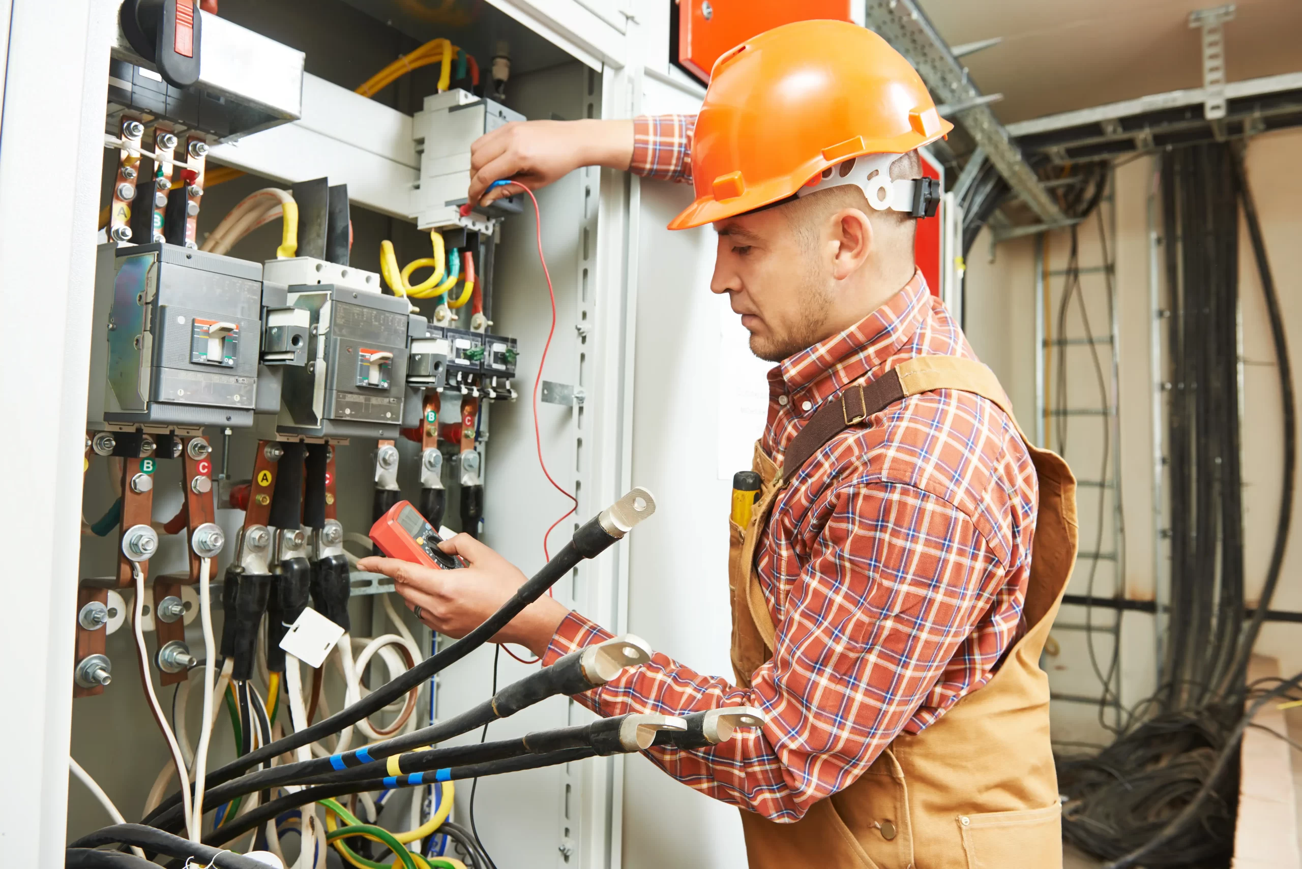 Electrician working on a panel.